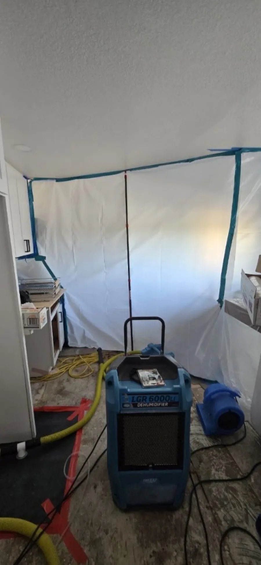 Commercial dehumidifier and air mover inside containment
