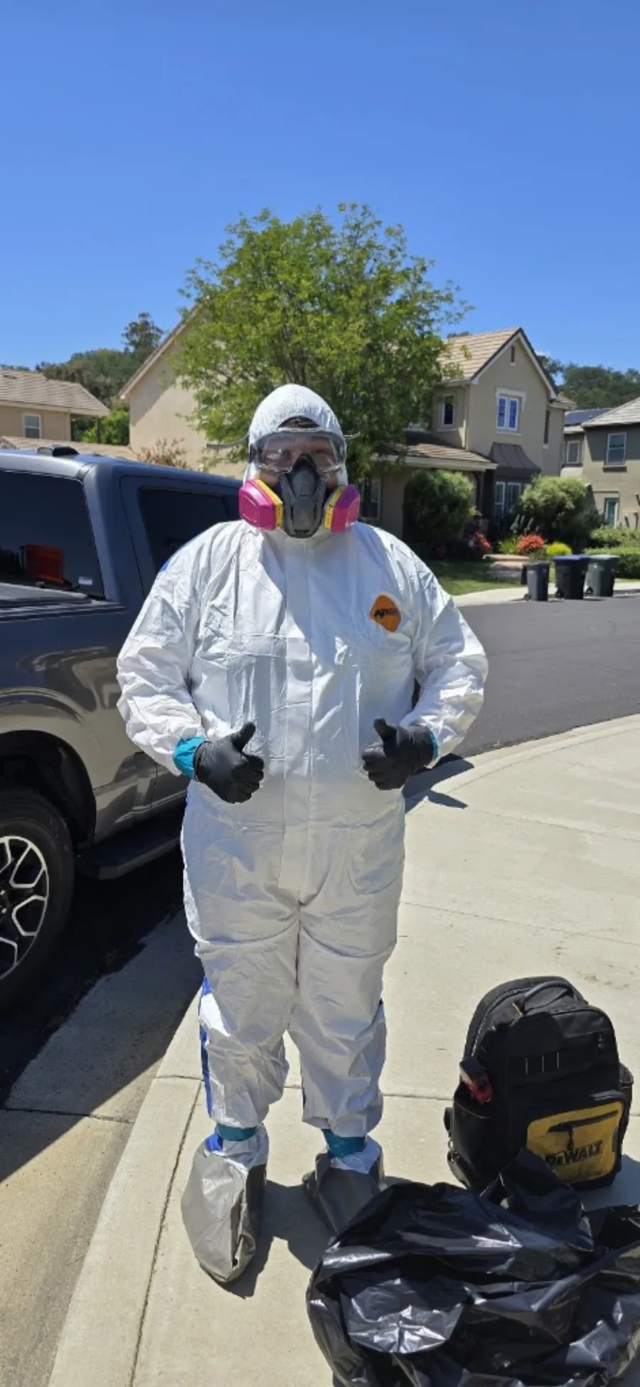 Restoration technician wearing protective equipment